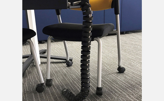 Funiture chain bridging the gap between desk and wall