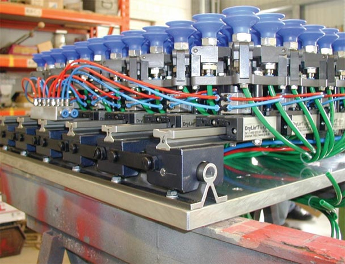 Robotic arm shown with aluminum shafting